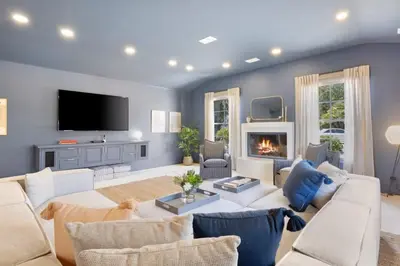 a living room with a white couch and a fireplace at Malibu Park by Stay Awhile Villas in Malibu