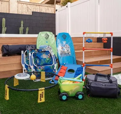 a group of childrens play equipment on the grass at The South Bay Retreat in Redondo Beach