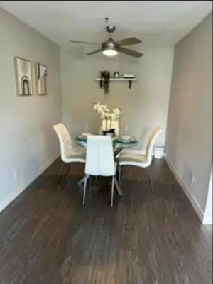 a dining room with a table and chairs and a ceiling fan at 2-Bedroom Hollywood Apartment in Los Angeles