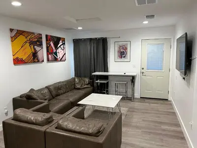 a living room with a couch and a table at Private gated 1bed & 1bath amazing for 2 in Los Angeles near Universal studio & Hollywood in Van Nuys Airport