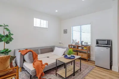 a living room with a couch and a table at Cute Guest Studio near Universal Studios sleeps 4 in Los Angeles