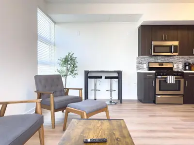 a living room with a couch and a table at Studio Suite - 5 Min Walk to Crypto Arena and Convention Center in Los Angeles