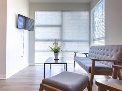 a living room with a couch and a table at Studio Suite - 5 Min Walk to Crypto Arena and Convention Center in Los Angeles