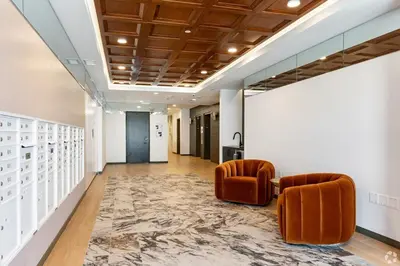 a hallway with two chairs and a rug at 3 Bedroom 2 Bath Westwood Condo in Los Angeles