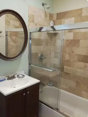 a bathroom with a shower and a sink and a mirror at Happy Room Near Citrus College in Glendora