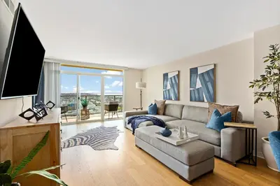 a living room with a couch and a tv at The Bleu Pearl 3Bed 2bath Venice Beach Santa Monica and Marina Del Rey in Los Angeles