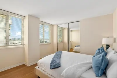 a white bedroom with a large bed and windows at The Bleu Pearl 3Bed 2bath Venice Beach Santa Monica and Marina Del Rey in Los Angeles