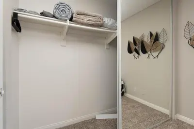 a room with a closet with towels and feathers at Chic Hollywood Retreat 2Bed Rooftop Pool with Iconic Views in Los Angeles