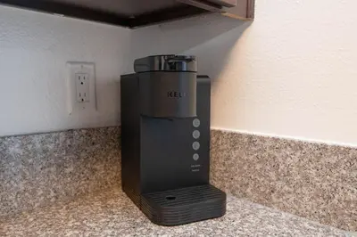 a black appliance sitting on top of a counter at Chic Hollywood Retreat 2Bed Rooftop Pool with Iconic Views in Los Angeles