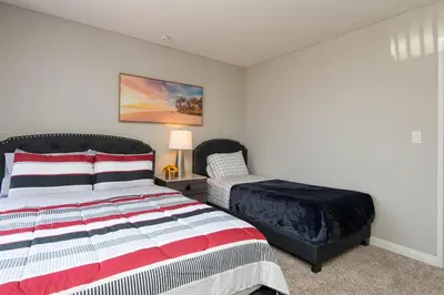 a bedroom with two beds and a bed sidx sidx sidx sidx sidx at Chic Hollywood Retreat 2Bed Rooftop Pool with Iconic Views in Los Angeles