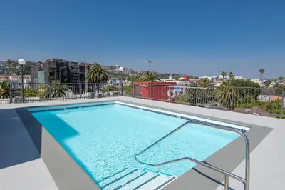 a swimming pool on the roof of a building at Hollywood Luxe 2BR Apartment with Rooftop Pool and Breathtaking Views in Los Angeles