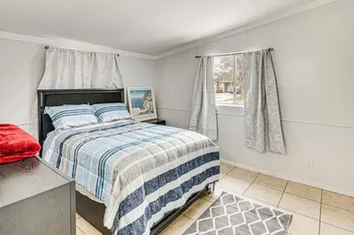 a bedroom with a bed and a window at Work, Play and Relax Home with Yard in Lancaster! in Lancaster