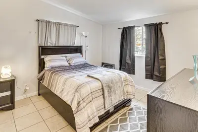 a bedroom with a bed and a window at Work, Play and Relax Home with Yard in Lancaster! in Lancaster