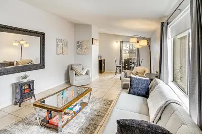 a living room with a couch and a table at Work, Play and Relax Home with Yard in Lancaster! in Lancaster