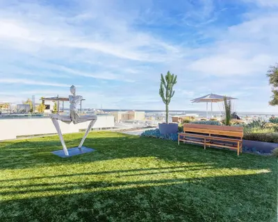 a park with a statue and a bench at Luxurious 2-Bedroom Retreat in Santa Monica in Los Angeles