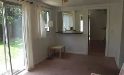 a living room with a table and a window at Best Prime Location Hollywood Private House in Los Angeles