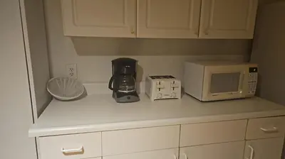 a kitchen counter with a coffee maker and a microwave at Best Prime Location Hollywood Private House in Los Angeles