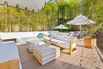 a patio with furniture and a swimming pool at Casa Cortona by Stay Awhile Villas in Los Angeles