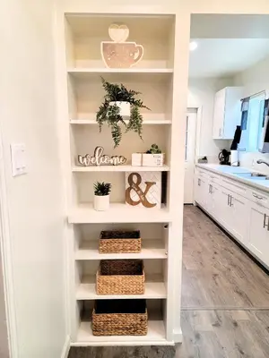 a shelf in a kitchen with wicker baskets at Perfectly located Pico Robertson ground floor 3 bedroom apartment Walk to restaurants WIFI TV Game Console Parking 5 minutes to Rodeo Drive in Los Angeles