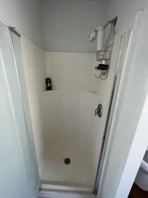a shower stall in a bathroom with a shower at B and G Studio Space Guesthouse in San Bernardino