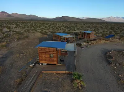 a group of houses in the middle of the desert at Secluded Glamping Eco-Pod Rental in the Mojave Desert near Ridgecrest, California in Ridgecrest