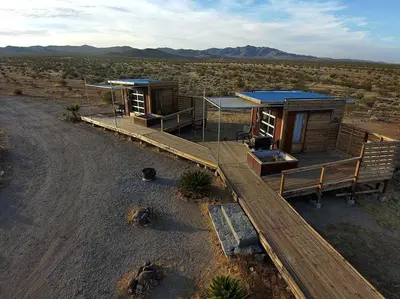a small building in the middle of a desert at Secluded Glamping Eco-Pod Rental in the Mojave Desert near Ridgecrest, California in Ridgecrest