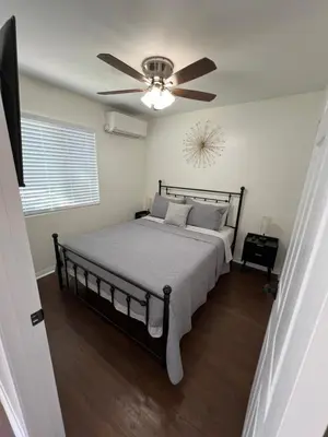 a bedroom with a bed with a ceiling fan at Mini-Home in Whittier in Whittier
