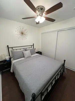 a bedroom with a bed with a ceiling fan at Mini-Home in Whittier in Whittier