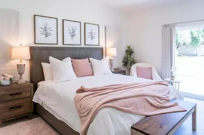 a bedroom with a large bed and a window at Newly built vacation home with large backyard in Diamond Bar