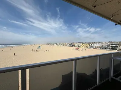 a view of a beach from a balcony at Oceanfront Sanctuary 1 BR Beach Access 218 in Hermosa Beach