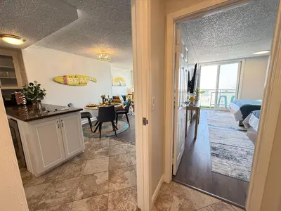 a kitchen and a living room with a dining room at Oceanfront Sanctuary 1 BR Beach Access 218 in Hermosa Beach