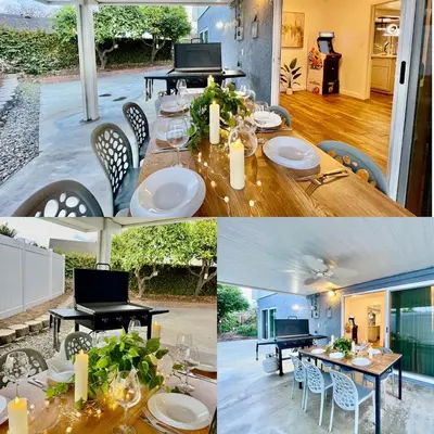 a dining room with a table and a laptop on it at Unique & Spacious house near Disney, Knott, BBQ in Buena Park