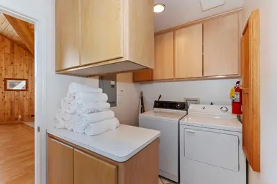 a kitchen with a pile of towels on a counter at Lakefront Estate with Views and Hot tub in Big Bear Lake