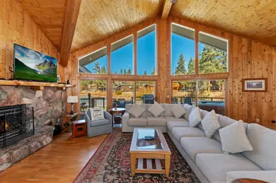 a living room with a couch and a fireplace at Lakefront Estate with Views and Hot tub in Big Bear Lake