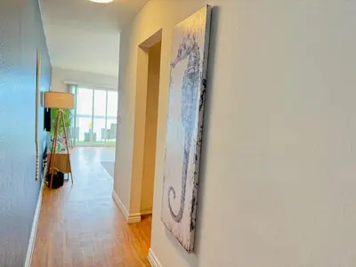a painting hanging on a wall in a hallway at Oceanfront 1 Bed 1 Bath, Parking, Amazing View 132 in Redondo Beach