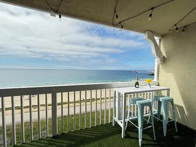 a balcony with a table and chairs and the ocean at Oceanfront 1 Bed 1 Bath, Parking, Amazing View 132 in Redondo Beach