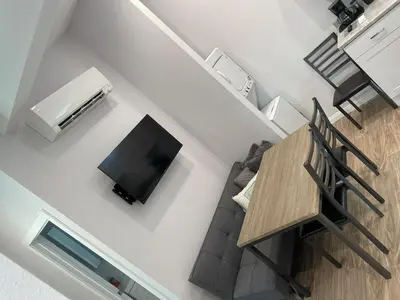 an overhead view of a living room with a table and a television at Modern 1-bedroom Studio with Kitchen and Laundry in Santa Clarita