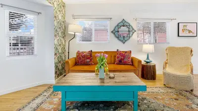 a living room with a couch and a table at 2 Units in Prime Hollywood Location Chic Renovated 1BDRs w Patio AvantStay in Los Angeles