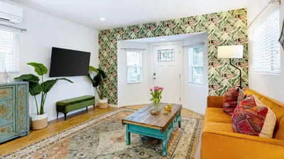a living room with a couch and a table at 2 Units in Prime Hollywood Location Chic Renovated 1BDRs w Patio AvantStay in Los Angeles
