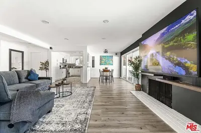 a living room with a large flat screen tv at Love & LuxuryHeart Shaped Pool Paradise in Los Angeles