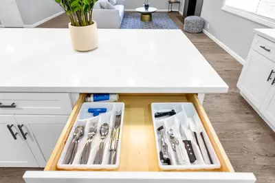 a kitchen counter with a drawer filled with utensils at Sunny Simi Valley Valley 4BR 3BR LTR Modern Home Dedicated Work Place High Speed internet in Simi Valley