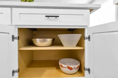 a kitchen cabinet with bowls on a shelf at Sunny Simi Valley Valley 4BR 3BR LTR Modern Home Dedicated Work Place High Speed internet in Simi Valley
