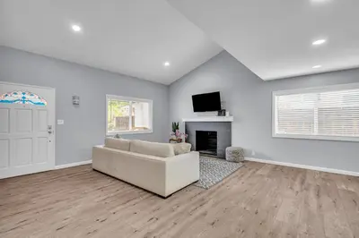 a living room with a couch and a fireplace at Sunny Simi Valley Valley 4BR 3BR LTR Modern Home Dedicated Work Place High Speed internet in Simi Valley