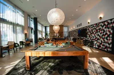 a lobby with a pool table in a room at Heart of North Hollywood 2 bed Apt FREE parking, hot tub, pool, gym in Garnsey