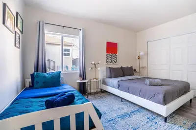 a bedroom with two beds and a window at Comfy Home Near Sofi Stadium 2 in Los Angeles