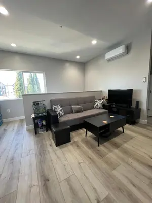 a living room with a couch and a table at Vacation home in Westminster