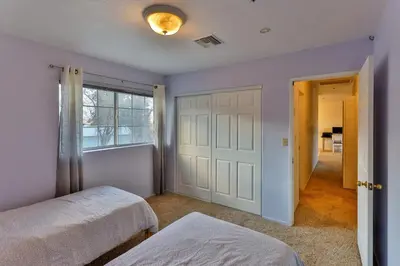 a bedroom with two beds and a window and a door at Amazing Escape near LA Meditation Room, Game room, Hot Tub, Pool in Leona Valley