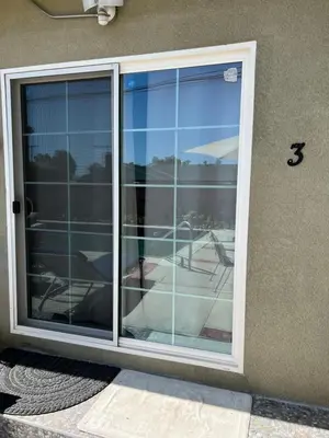 a window on the side of a house at Pool Front Romantic Getaway withPrivate Entry in North Hills
