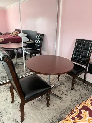 a room with two tables and chairs and a bed at Pool Front Romantic Getaway withPrivate Entry in North Hills