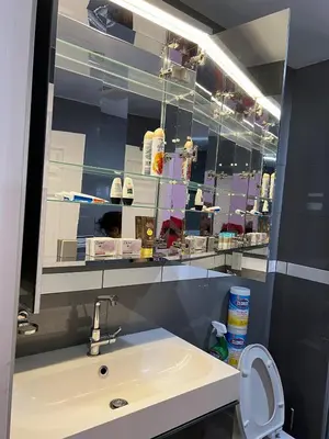 a bathroom with a sink and a mirror at Pool Front Romantic Getaway withPrivate Entry in North Hills